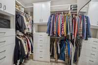 *PRIMARY WALK-IN CLOSET WITH CUSTOM SHELVING AND DRAWERS*