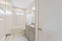 3rd full bath features large vanity and deep soaking tub.