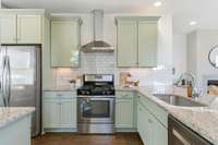 Kitchen refreshed with newly painted cabinetry for a bright, timeless look