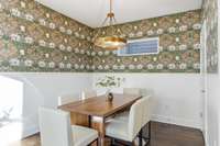 Newly installed designer wall coverings, moulding and chandelier.