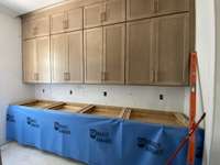 Current stage of construction as of 10/22/25. Brick & hardie board installed on exterior & cabinets installed on interior.