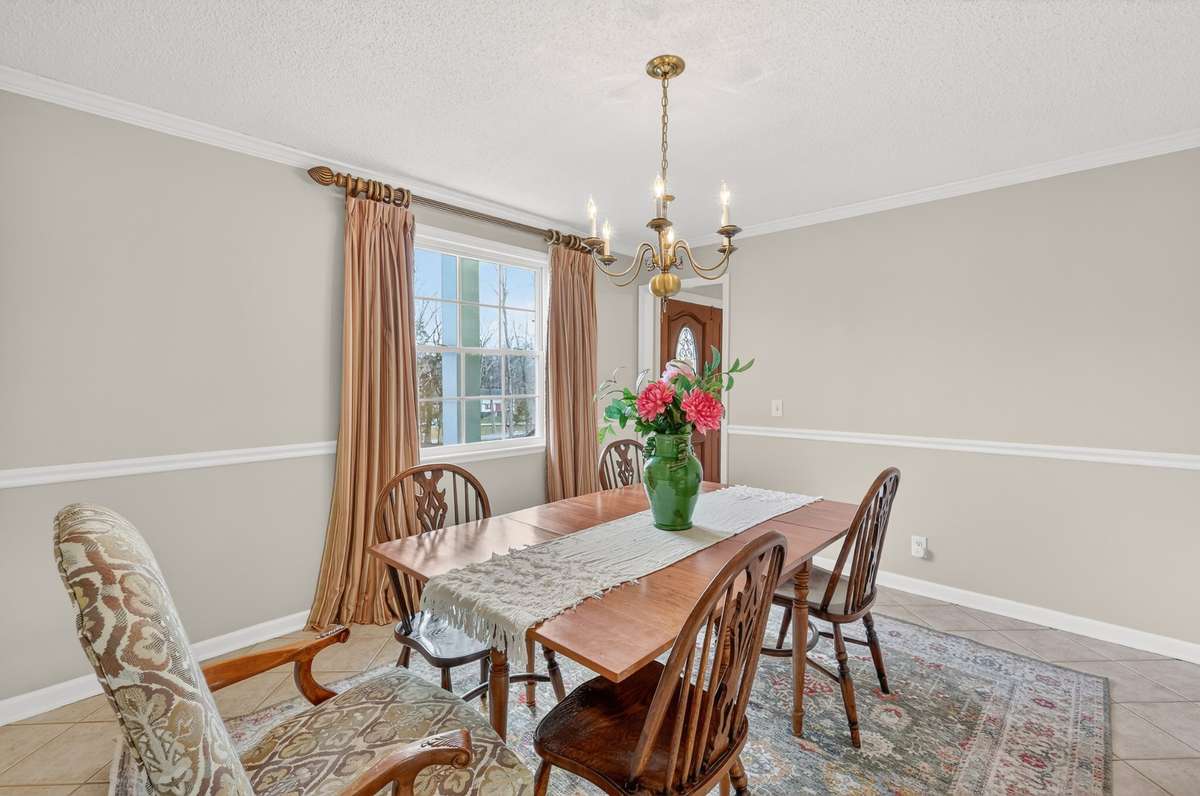The dining room easily has room for a table that seats 8 as well as serving pieces