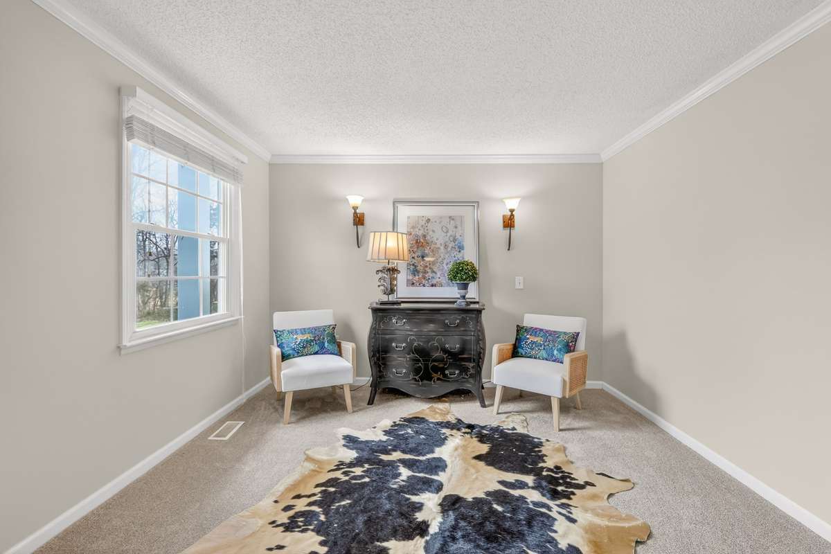 Located just off the foyer, this home office has lots of work space or can be used as a formal living space or library/music room