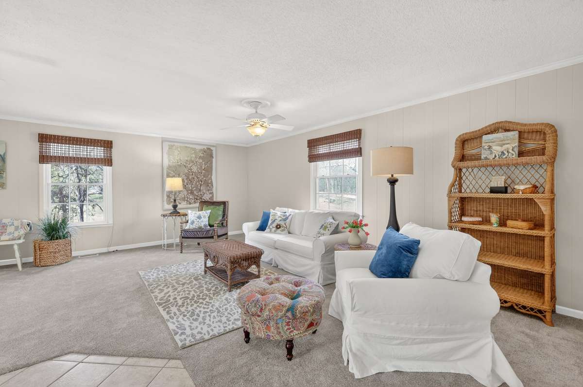This LARGE den on the main level and just off of the kitchen is the perfect place for the kids to play and still be close to the kitchen