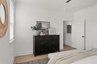 Another view of the primary bedroom, where luxury meets comfort. This generous space offers a serene retreat, complete with large windows that flood the room with natural light and provide stunning views.