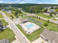 Second of the three community pools with lounge seating. A serene space for cooling off and enjoying the outdoors.