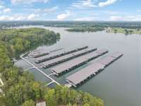 Aerial showing covered slips at the marina. Convenient access for boat owners and a key feature of Twin Creeks’ waterfront living.