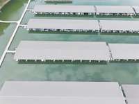 Aerial showing covered slips at the marina. Convenient access for boat owners and a key feature of Twin Creeks’ waterfront living.