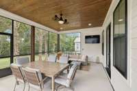 Expansive screened porch overlooks the backyard and wooded creek. A peaceful retreat with room for dining, lounging, and entertaining. Perfect for bug free evenings outdoors.
