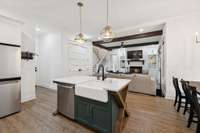 Elegant tile backsplash, stylish lighting, and quality finishes make this kitchen both functional and beautiful. Every detail was thoughtfully designed to elevate the cooking and entertaining experience.