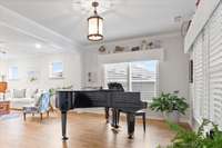 Breathtaking sunroom , the whole home has plantation shutters