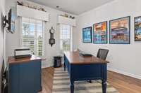 The office /flex space overlooks the lush landscaping and the incredible front porch