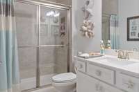 Secondary bathroom features a walk in shower