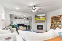 The living area features a gas fireplace and an abundance of natural light