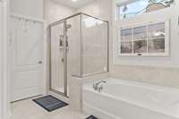 Primary Bathroom features soaking tub and separate shower
