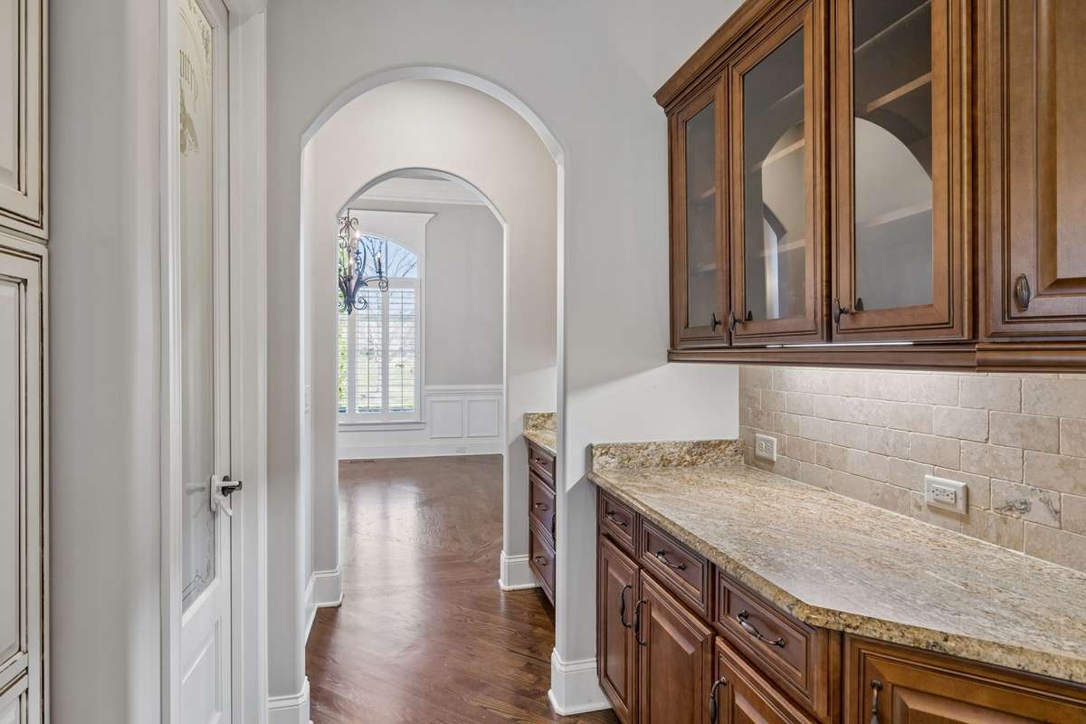 View from kitchen to dining room.  Pantry door on the left.
