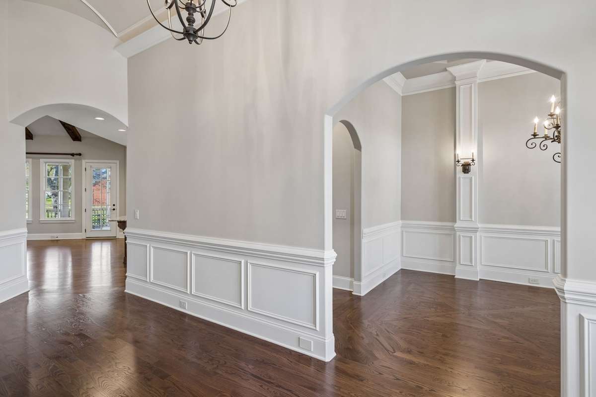 Arched doorways and rounded corners add to the custom feeling of this beautiful home!