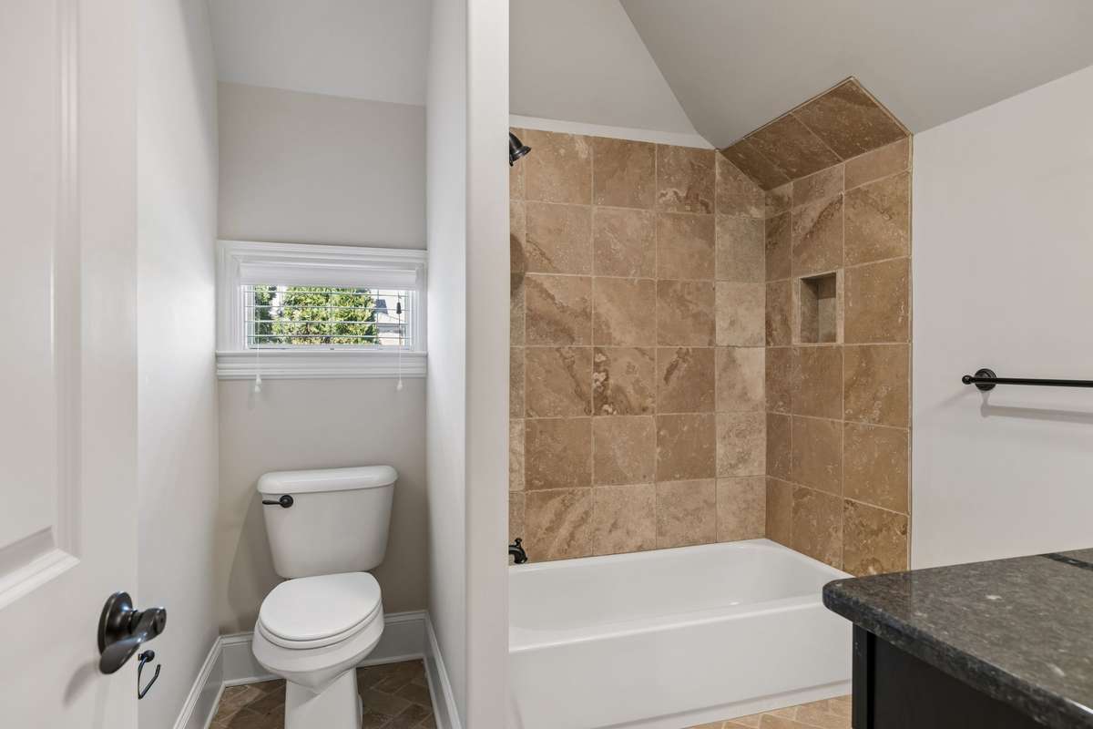 A full bath upstairs.   There is plenty of unfinished attic space to add a fifth bedroom if needed.