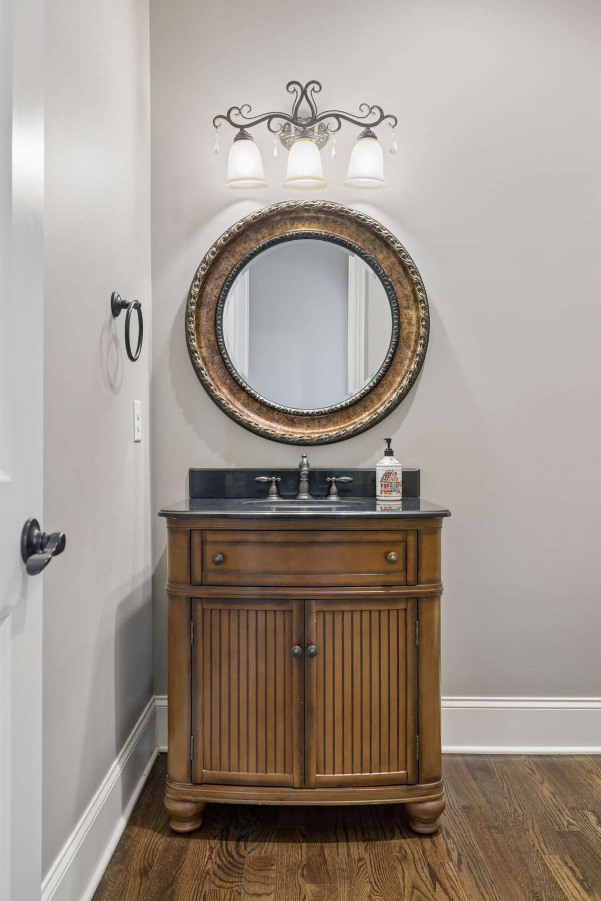 Powder room conveniently located off entry hallway.