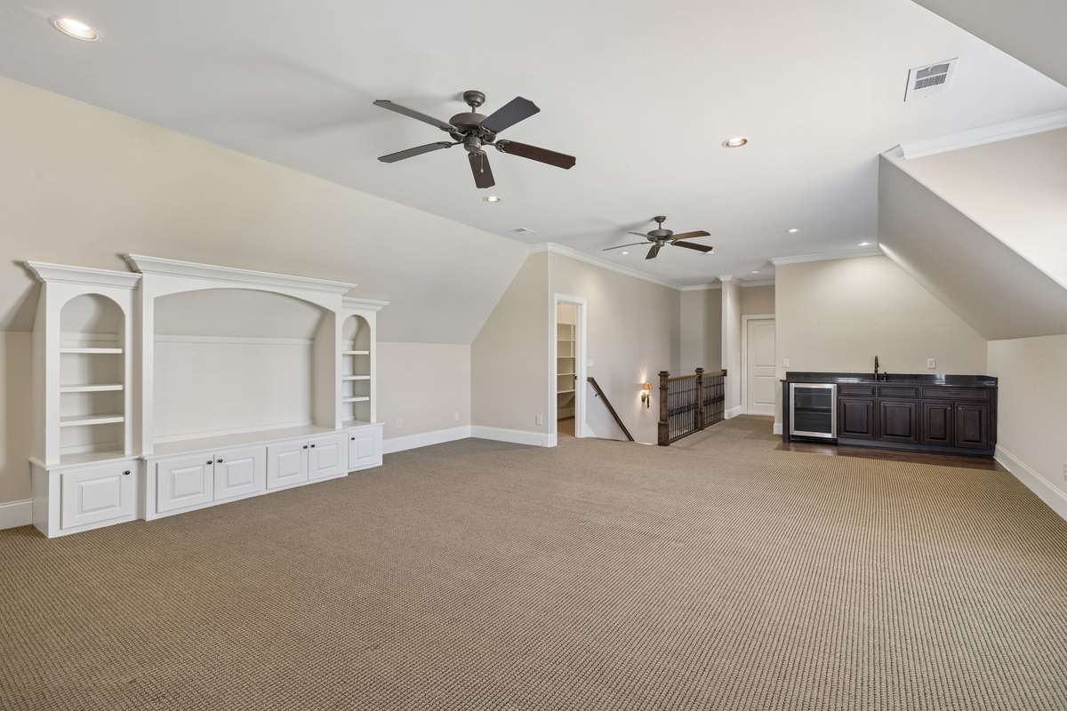 Note the large game closet at the top of the stairs.
