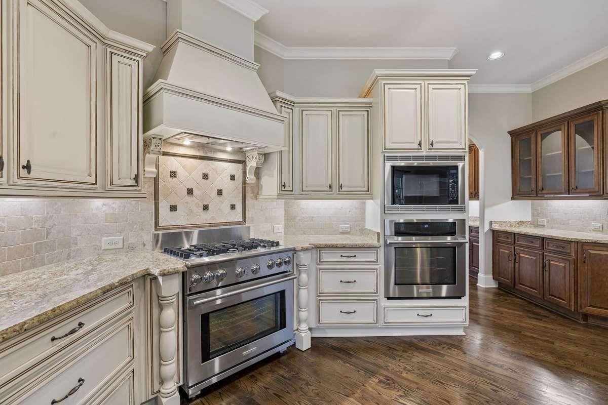 Note the second countertop area for setting up buffet.  Glass cabinets above for display.