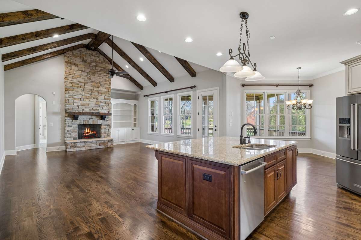 Large seating area in great room that looks out to screened in porch.