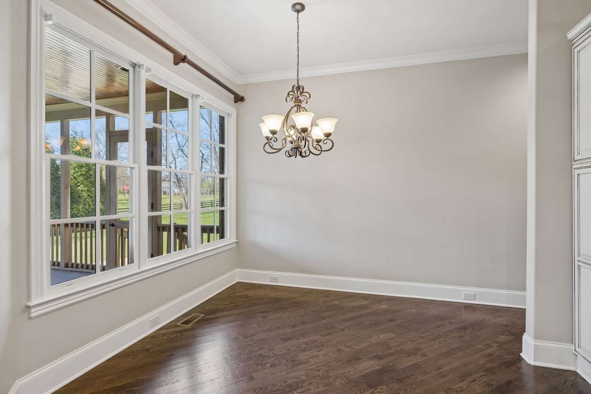 Large light filled breakfast room looks out to tranquil backyard.