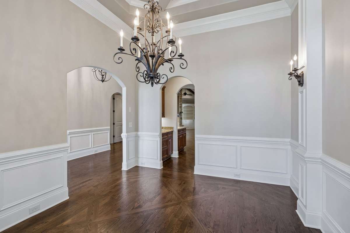 Butlers pantry connects dining room to kitchen area.
