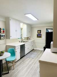 The kitchen includes enough space for breakfast table and seating for two.