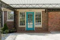 Cheery entrance from the carport leads to the bonus space and provides easy access to the kitchen.