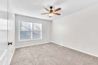 Bedroom 3 is also located upstairs with updated fixture.