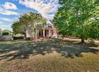 The lot is spacious, level, & ready for a new owner.