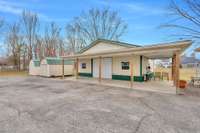 A new detached Garage/Workshop with wraparound porch is another great amenity of this property.