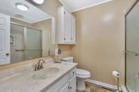 A full hallway bath is convenient for guests.