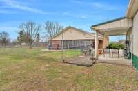 The Detached Garage has a charming covered sunporch/patio.