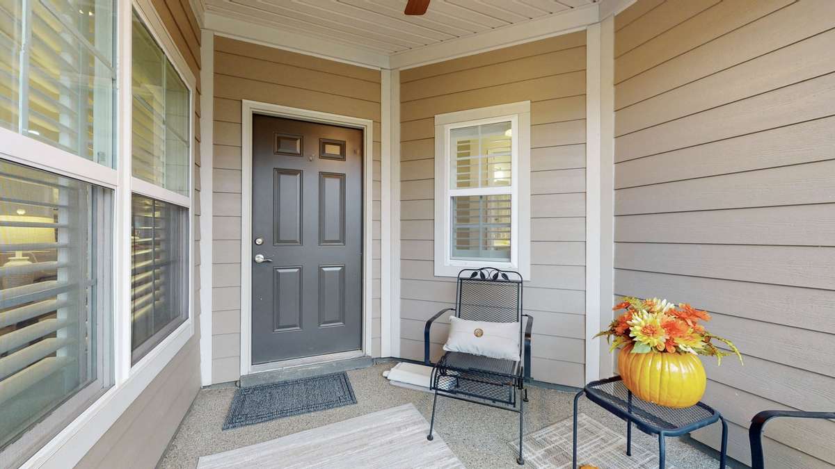 Covered sunroom with epoxy flooring.  Enjoy it year round!