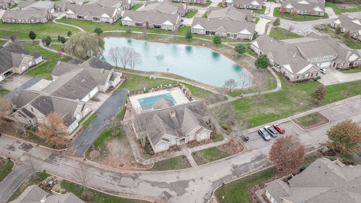 Community clubhouse, pool, pond, and walking trail