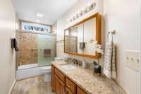 Tiled tub, upgraded stone countertops. Freshly painted.