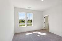 Plenty of light AND space for your bedroom furniture! Actual photo of home.