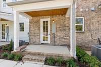 Your new home isn't just attractive from the front-- you'll have something to look forward to whether you walk in your front or back door! Actual photo of home.