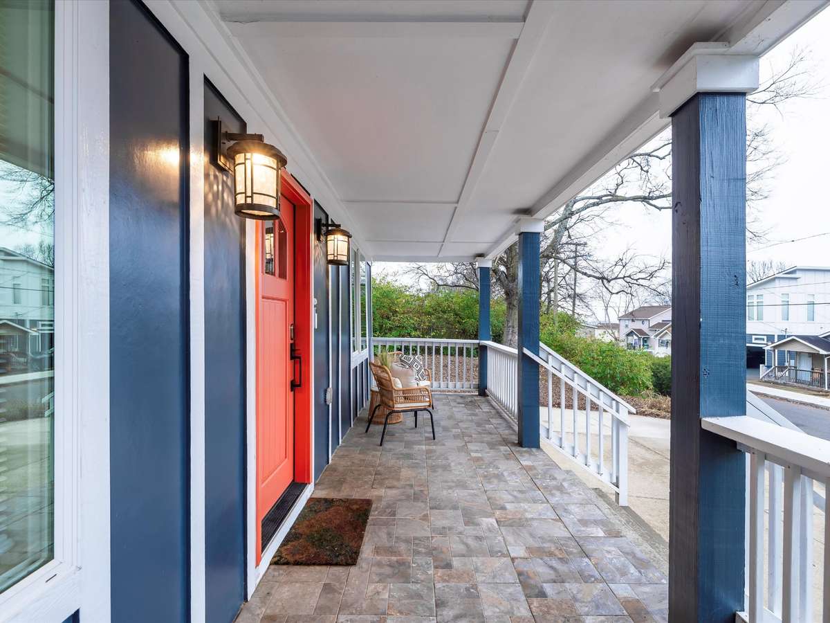 This covered porch is calling your name to come sit, sip and enjoy the neighborhood.