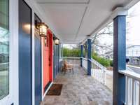 This covered porch is calling your name to come sit, sip and enjoy the neighborhood.