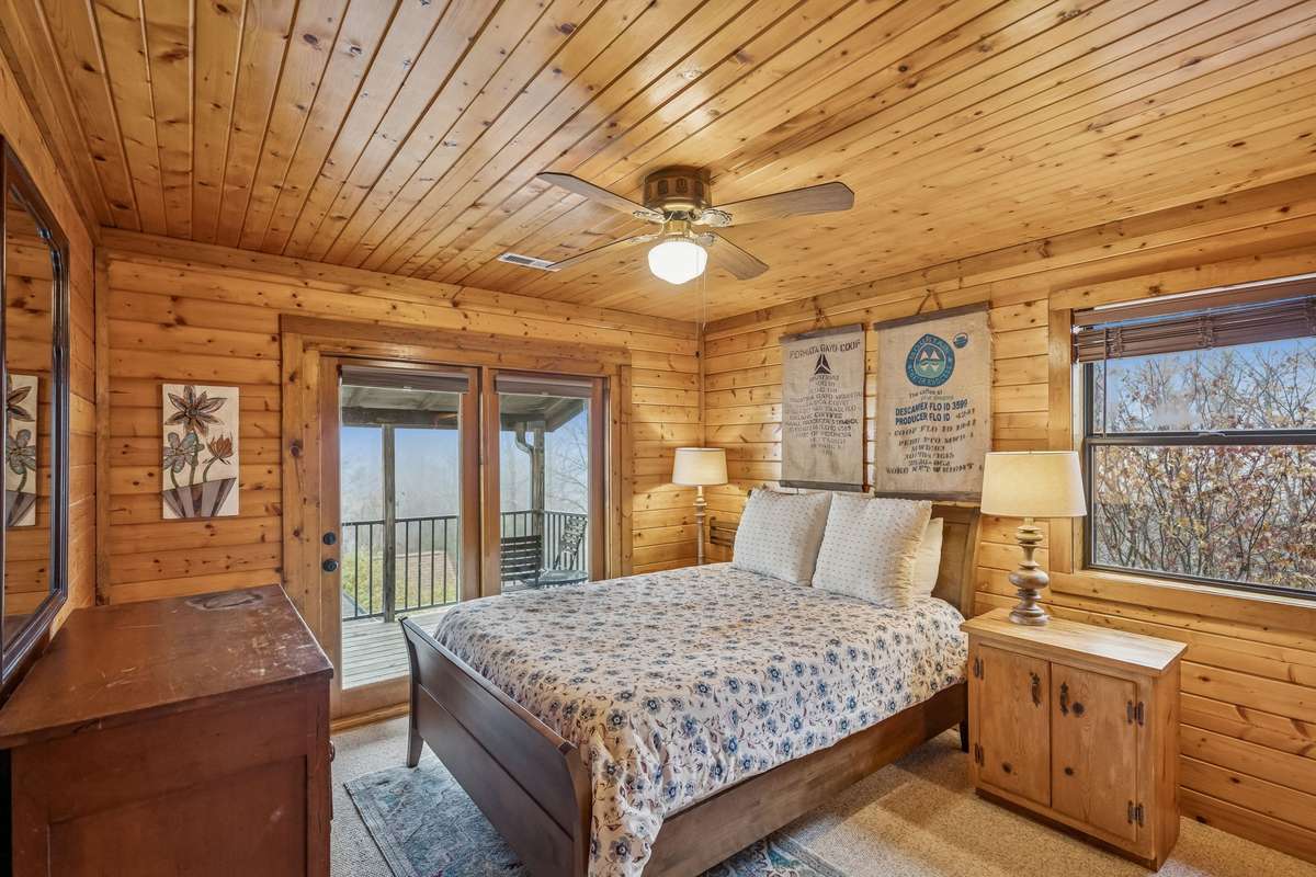 One of two upstairs bedrooms, with ensuite, large closet, and private balcony.