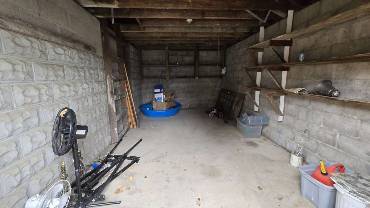The ladder on the left leads to attic storage.