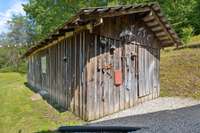 A closer look at this 20x12 rustic storage shed—perfectly placed for convenient access, ideal for storing tools, equipment, and outdoor essentials.