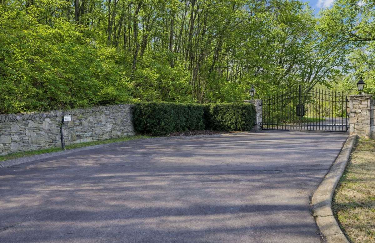 The gated entrance creates a private approach