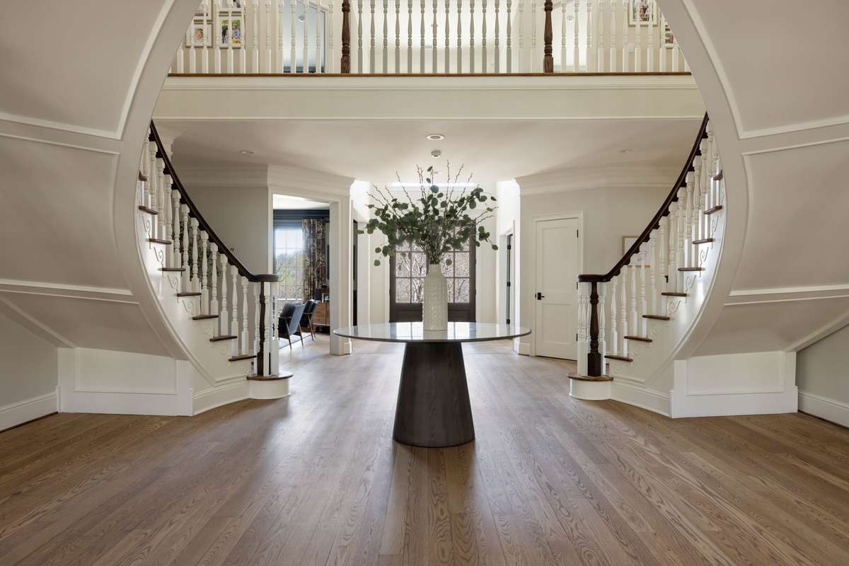 The architectural staircase detail showcases craftsmanship and design