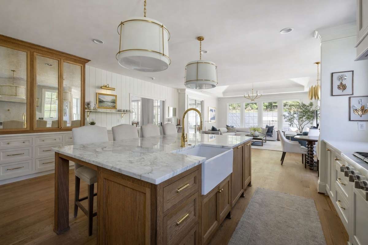 The kitchen has island seating and open flow to living room