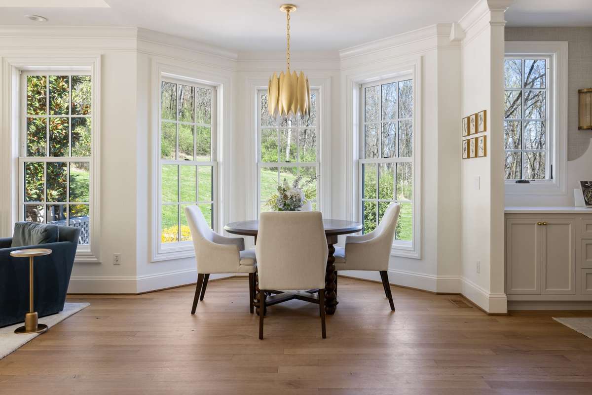 Breakfast area with bay windows overlooking the property