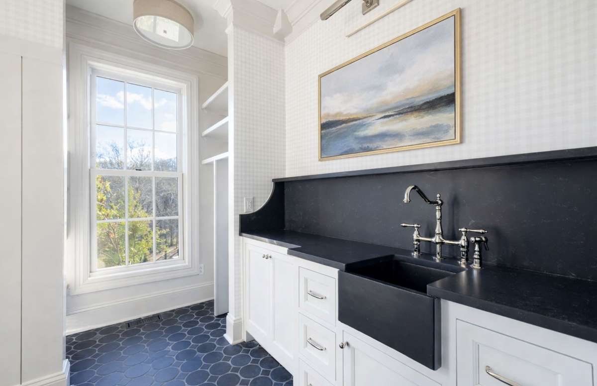 Laundry with ample workspace and storage